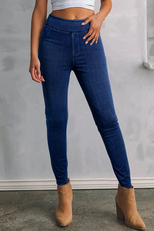 Dark wash denim jeggings with faux pockets and a comfortable elastic waistband.