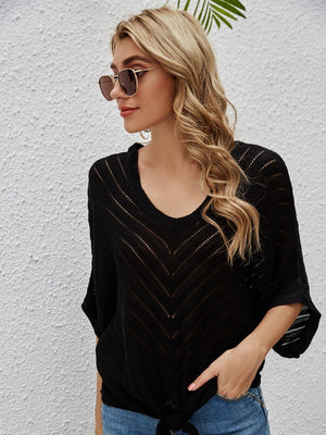 Black chevron knit tie-front cover-up with batwing sleeves and V-neck.