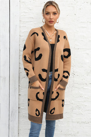 Khaki leopard print knit cardigan with black striped trim and pockets.