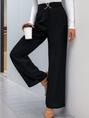 Black wide leg trousers with a gold buckle belt detail and a cinched waist.