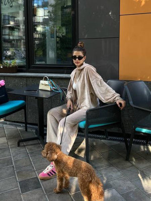 Plush velour lounge set in Sand, featuring wide-leg pants and a hooded jacket.