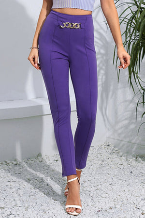 Chain detail high-waisted skinny trousers in electric purple with a gold chain belt detail.