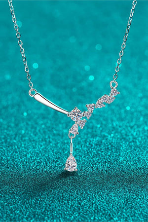 Silver asymmetrical moissanite cluster pendant necklace with a teardrop accent.