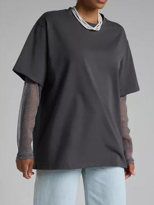Dark gray oversized tee with sheer sparkly long sleeves layered underneath.