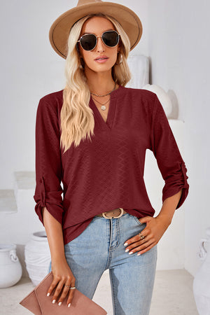Burgundy textured henley shirt with V-neck and roll-tab sleeves