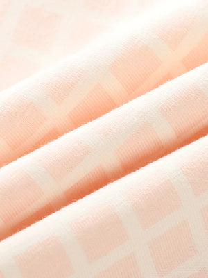 Charming Striped Peplum Set for kids in soft cotton with a subtle geometric pattern.