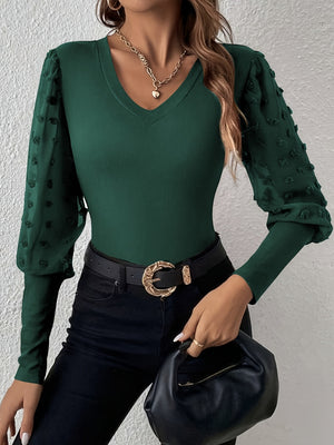 Dark green ribbed bodysuit with sheer pom-pom detail sleeves and V-neck