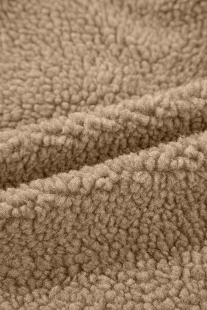 Sherpa-lined hooded jacket in brown, showing fuzzy texture detail.