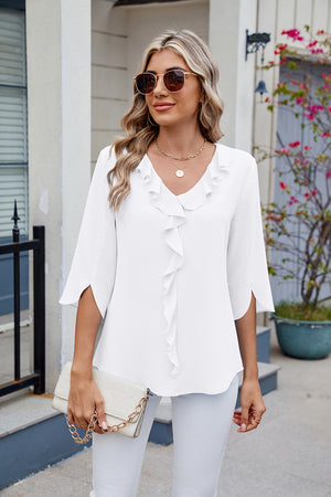 White V-neck flutter sleeve blouse with ruffled front detail.