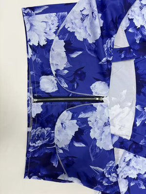 Ruffled floral two-piece set in Light Indigo polyester with a zippered detail.