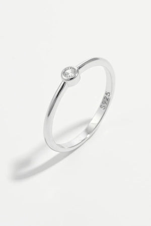 Solitaire silver ring with a single clear zirconia stone on a 925 sterling silver band.
