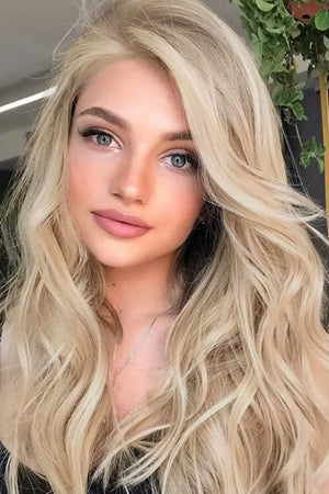 Blonde lace front wig with cascading beachy waves and a comfortable cap.