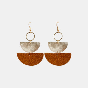 Textured leather and metallic half-moon earrings in caramel and gold.