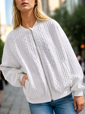White cable knit bomber jacket with full zip and ribbed cuffs.