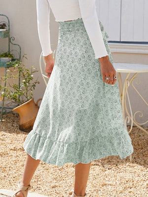 Asymmetric wrap skirt in Gum Leaf with a delicate leaf print and ruffled hem.