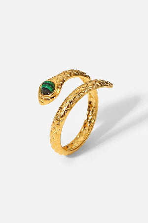 Gold serpentine ring with malachite eye detail and textured band