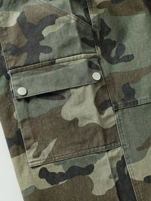 Relaxed fit camouflage cargo pants with button flap pockets and green, brown, and black pattern.