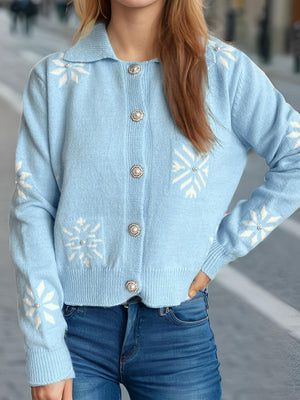 Pastel blue knit cardigan with pearl embellished snowflake pattern and button front.