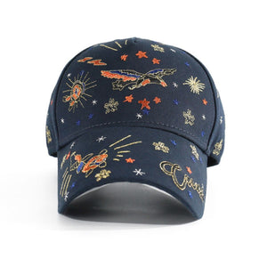 Navy blue cotton baseball cap with intricate embroidered celestial and flying motifs.