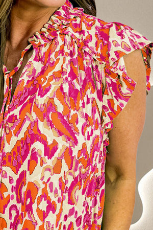 Printed ruffle cap-sleeve blouse in abstract print, featuring a tie-neck and ruffled cap sleeves.