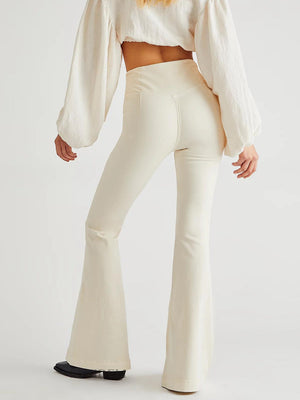 Cream flare denim jeans with a v-shaped yoke detail and flared leg