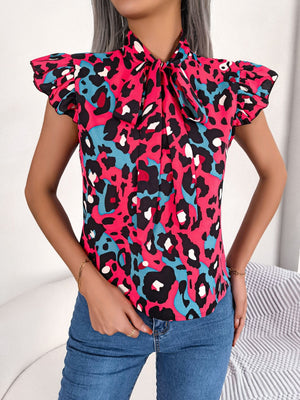 Hot Pink leopard print blouse with ruffled sleeves and pussybow tie.