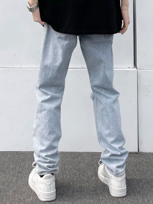 Light blue distressed 100 cotton slim fit jeans with a ripped detail on the leg.