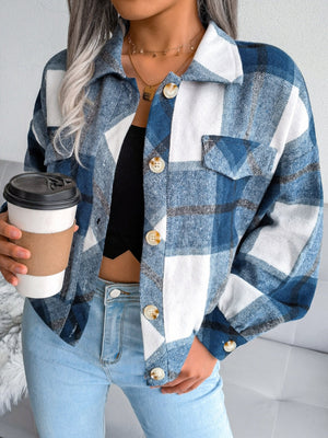 Oversized blue tartan shacket with patch pockets and button front.