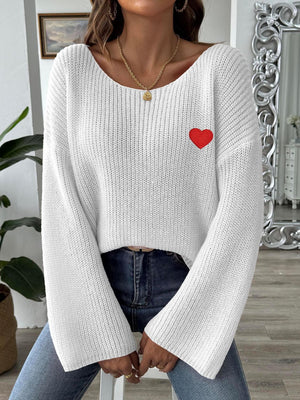 White slouchy boatneck knit sweater with embroidered red heart detail.
