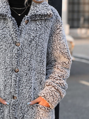 Teddy bear textured button-down coat in grey with brown buttons.