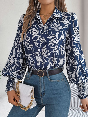 Navy floral print blouse with shirred cuffs and buttoned front