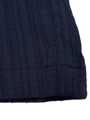 Navy ribbed peplum tube top detail with wide-leg pants set fabric texture