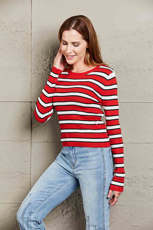 Ribbed stripe knit crewneck sweater with long sleeves and a boat neckline.
