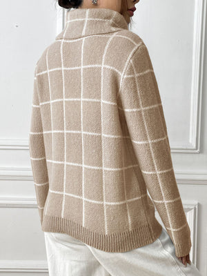 Tan turtleneck sweater with white grid pattern and ribbed trim.