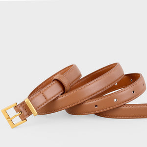 Brown leather skinny belt with golden buckle and adjustable holes.