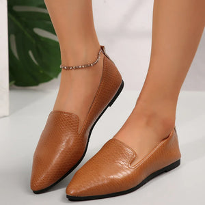 Textured pointed-toe slip-on loafers in Ochre with a subtle snakeskin pattern.
