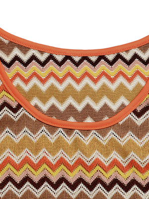 Zigzag knit two-piece set with orange trim and a colorful chevron pattern.