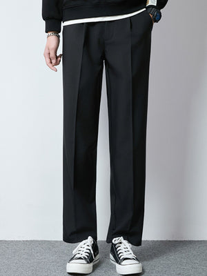 Men's black wide-leg casual pants with a relaxed fit and pleats.