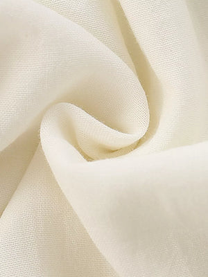Cream cotton blend fabric detail, showing texture and drape
