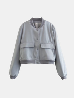 Boxy bomber jacket in light blue with two chest pockets and ribbed collar, cuffs, and hem.