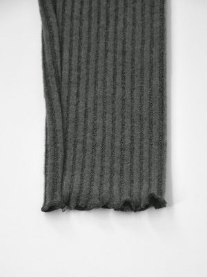 Dark gray ribbed knit top with lettuce hem detail