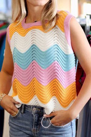 Chevron knit tank top with pink, orange, white, and blue stripes, featuring a crew neck and open knit details.