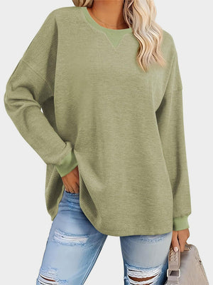 Sage waffle knit raglan sleeve sweatshirt with crew neck and contrast trim.