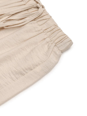 Chic tan waist-tie flare trousers with elasticated waistband and drawstring detail.