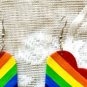 Rainbow heart pride drop earrings with multicolor stripes and alloy hooks.