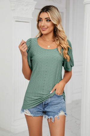 Green eyelet puff sleeve scoop neck blouse with textured pattern