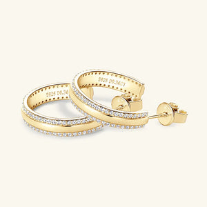 Gold pavé moissanite C-hoops in sterling silver with diamond accents.