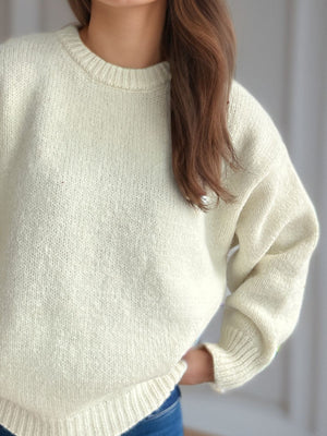 Oversized crewneck sweater in white textured knit with ribbed cuffs and hem.