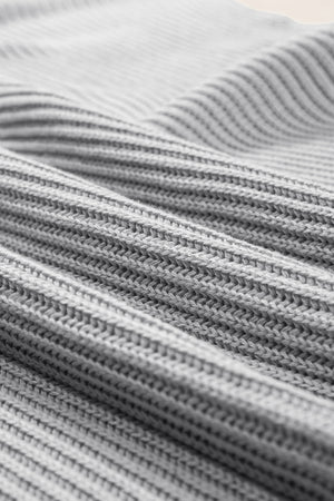Gray ribbed knit cape sleeve top with a textured stitch detail.