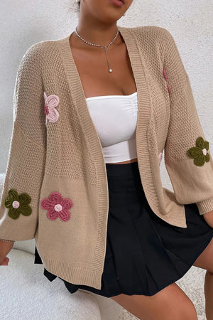 Khaki knit cardigan with embroidered pink and green flowers, open front, long sleeves.